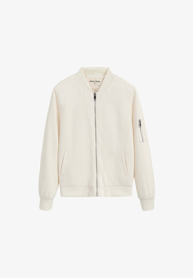 Veste bomber couleur crème avec une texture douce en chevron, fermeture éclair à l'avant, poignets côtelés, et deux poches latérales, dont une avec une fermeture éclair.