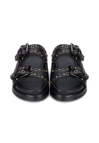 Sandali in pelle nera con doppi cinturini a fibbia, dettagli circolari e cristalli, suola piatta e design open toe.