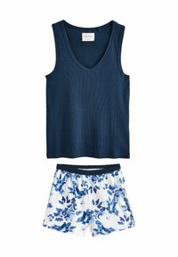 Navy ribbed tank top with a V-neck and matching white shorts featuring a blue floral pattern and an elastic waistband.