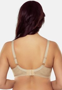 Beige BH mit verstellbaren Trägern, glatter Textur und dreifacher Hakenverschluss hinten mit einem dezenten Mesh-Einsatz.