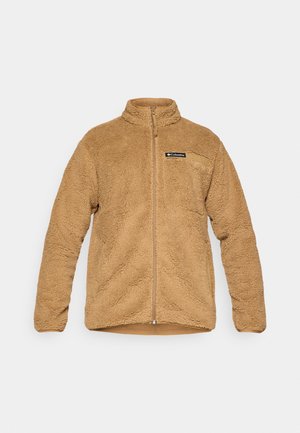 Veste en polaire beige avec un col montant, une fermeture éclair intégrale et une poche poitrine. Offre une surface texturée et une coupe décontractée pour le confort.