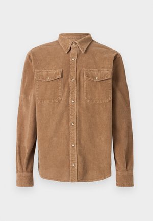 Camicia in corduroy marrone con colletto button-down, due tasche sul petto e superficie testurizzata. Presenta chiusura con bottoni e maniche lunghe.
