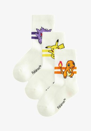 White crew socks featuring Pikachu, Charmander, and Gengar characters. Each sock has vibrant color accents and unique character graphics.