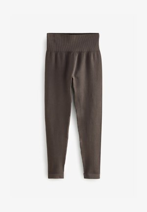 Dunkelbraune Leggings aus geripptem Material mit einem breiten, elastischen Bund und schmal zulaufendem Bein. Nahtloses Finish ohne sichtbare Muster.