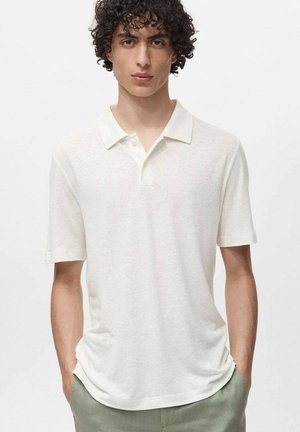 Cream-colored polo shirt with short sleeves, made of a soft, lightweight fabric. Features a classic collar and a relaxed fit.