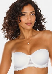White strapless bra with a smooth satin finish, lace trim, and bow detail at the center. Features a molded cup design for support.