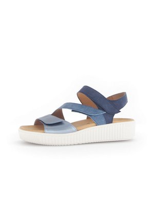 Two-tone blue sandals with a smooth upper, adjustable cross straps, a cushioned footbed, and a textured white sole.