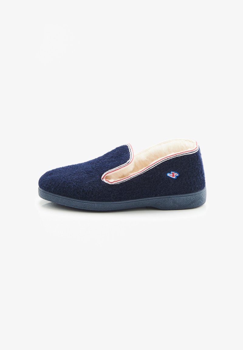 Marineblauwe slipper van gestructureerde stof, met een zachte crèmekleurige binnenkant, contrasterende bies en een flexibele rubberen zool met logodetail.