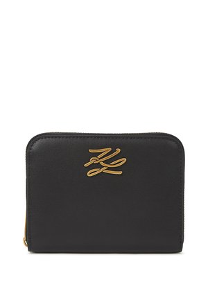 Black leather wallet with gold hardware. Features a smooth texture and embossed logo on the front. Rectangular shape with a zip closure.