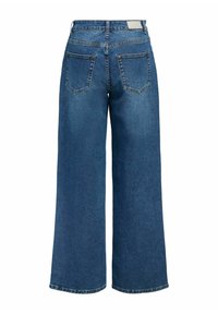 Modré džínové kalhoty s širokými nohavicemi a vysokým pasem, zadními kapsami a čistým zakončením. Na zadním pasu je štítek značky.