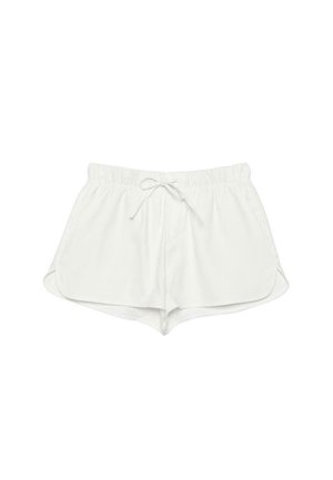 Shorts blancs décontractés avec taille élastique et cordon à l'avant, avec des ourlets latéraux arrondis et un tissu léger.