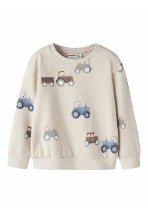 Sweat-shirt beige pour enfants avec des illustrations de tracteurs bleus, bruns et gris éparpillées sur le devant et les manches.