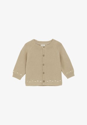 Beige stickad cardigan med långa ärmar, rundad halsringning, knappstängning fram och dekorativ vit sömnad längs fållen och ärmarna.