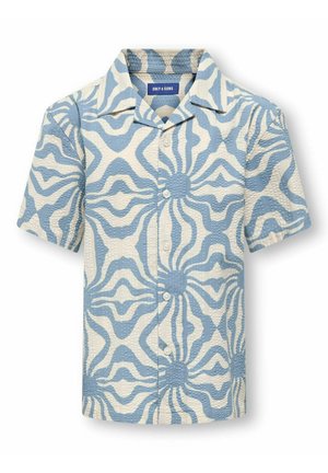 Chemise à manches courtes boutonnée avec un motif abstrait bleu et blanc en forme d'éclat de soleil et tissu texturé.