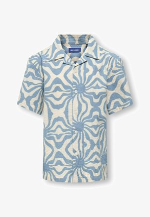Chemise à manches courtes boutonnée avec un motif abstrait bleu et blanc en forme d'éclat de soleil et tissu texturé.