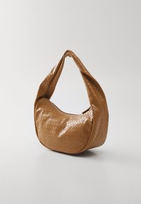 Woven brown leather handbag with a rounded shape, a thick twisted handle, and a zip closure along the top. Glossy finish, textured pattern.