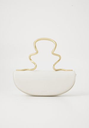 White half-moon shaped handbag with smooth leather texture and abstract wavy gold handle on a plain white background.