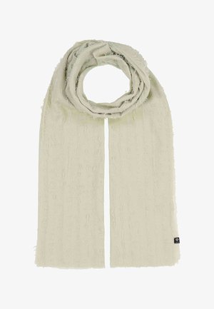 Hellbeiger Schal mit strukturierten vertikalen Fransen, oben gefaltet mit einem kleinen schwarzen Markenzeichen am unteren rechten Rand.