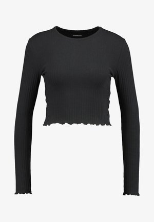 Černý žebrovaný dlouhý rukáv crop top s kulatým výstřihem a vlnitým lemem. Vyrobeno z elastického materiálu pro přiléhavý vzhled.