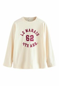 Hanorac crem cu mânecă lungă, având inscripții în burgund: "LE MARAIS 62 4TH ARR." Material din bumbac moale cu o croială lejeră și guler rib.