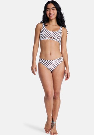 White bikini set featuring a floral pattern in dark brown, with a sports bra-style top and classic-cut bottoms. Soft, stretch fabric.