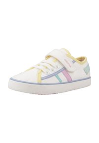 Zapato casual blanco con rayas pastel en azul, rosa y amarillo, con una tira de velcro y parte superior de lona texturizada. Suela de goma.