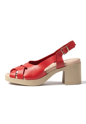 Red leather slingback sandal with beige block heel, open toe, and adjustable buckle strap.