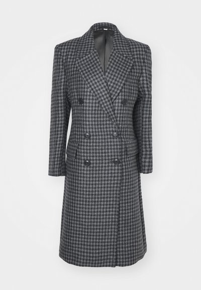 Kahe nööbiga must ja hall šakali mustriga mantel, millel on lõigatud kraed, pikad varrukad, kaks eesmist taskut ja nööbikaunistused.