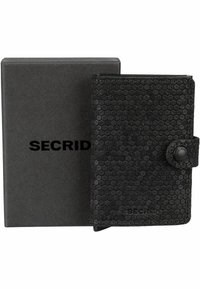 Black wallet made of textured material with a honeycomb pattern. Features a button closure and comes in a black box labeled "SECRID."