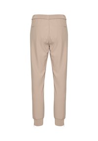 Béžové kalhoty s tapered střihem, s hladkým povrchem, elastickými manžetami a zadními kapsami, navržené pro elegantní siluetu.