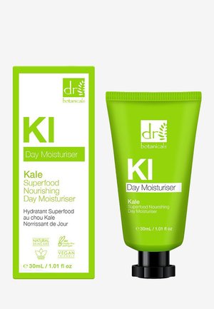 Green tube of KI Day Moisturiser labeled "Kale Superfood Nourishing." Accompanied by a green rectangular box with white text and logo.
