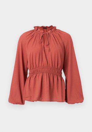 Bluse in Rostfarbe mit gerafftem Ausschnitt, verstellbarer Kordel und geraffter Taille. Hat lange, weite Ärmel und weiches, glattes Material.