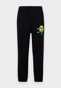 Black sweatpants with an elastic waistband and a graphic of a smiling ice cream character on the left leg in yellow, pink, and blue.