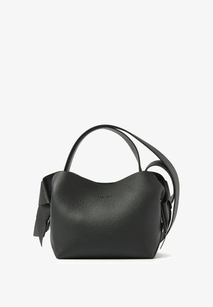 Black leather handbag with a textured surface, curved shape, and a single shoulder strap. Features a decorative bow on one side.