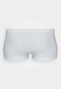 White cotton boyshorts with a seamless design, mid-rise waist, and smooth texture. Features a plain finish without patterns or embellishments.