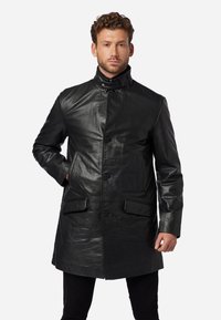 Black leather coat with a high collar, front button closure, two front pockets, and a smooth, shiny texture.