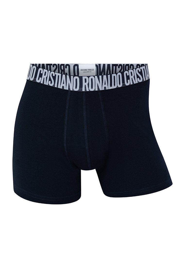 Bóxer de color azul marino con una cinturilla elástica blanca que presenta el texto "CRISTIANO RONALDO"; fabricado en una tela suave y elástica.