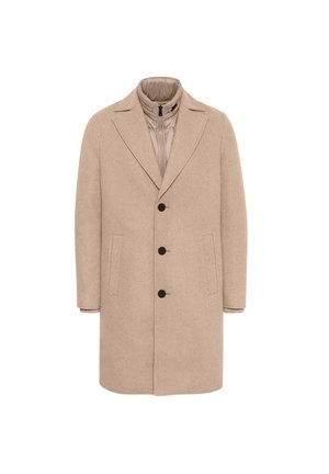 Beige gyapjúkabát, következő sarkantyúval, steppelt bélésű, öt gombbal és két oldalsó zsebbel. Simaszerkezetű, testhezálló fazon.