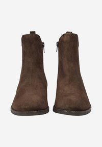 Stivaletti alla caviglia in suede marrone con una superficie liscia, dotati di una cerniera laterale per una facile calzata e un design a punta rotonda. Suola sottile e piatta in gomma.