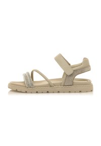 Sandalias de tiras beige con un upper texturizado y acentos de piedra preciosa, correa ajustable de Velcro y una suela ligera con un dibujo patrón.