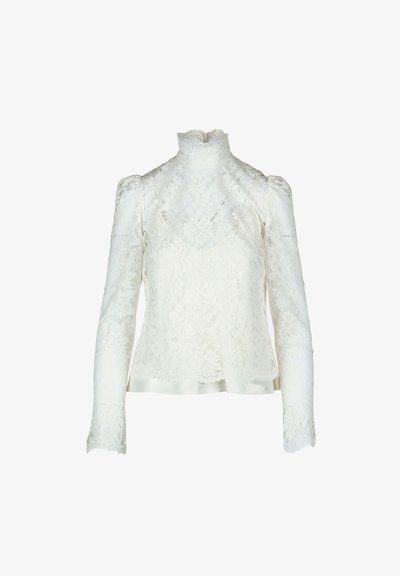 Weiße Spitze-Oberteil mit hohem Kragen, gepufften langen Ärmeln und floralem Muster. Satinstreifen entlang des unteren Saums für zusätzlichen Detail.