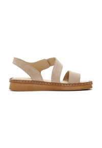 Sandale en suede beige avec deux larges brides, bout ouvert et support arrière. Semelle en caoutchouc marron épaisse avec détails cousus et finition texturée.
