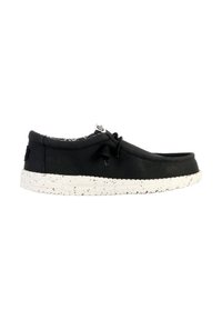 Scarpa di tela nera con punta arrotondata, suola in gomma bianca maculata e motivo interno a contrasto. Caratterizzata da un design con lacci e dettaglio del logo.