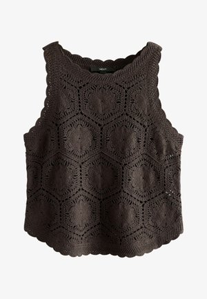 Haut sans manches en crochet noir avec des motifs floraux hexagonaux et des bords en forme de vague, étiqueté "NEXT" au niveau de l'encolure.