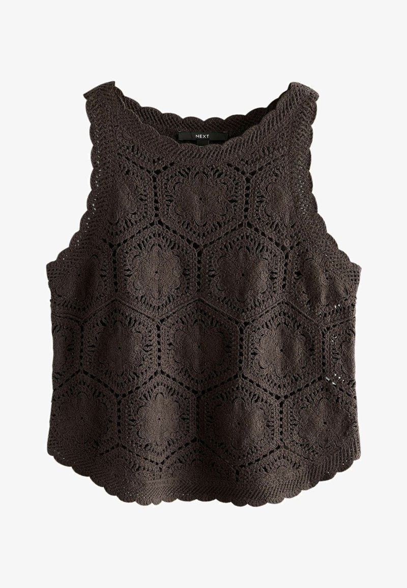 Haut sans manches en crochet noir avec des motifs floraux hexagonaux et des bords en forme de vague, étiqueté "NEXT" au niveau de l'encolure.