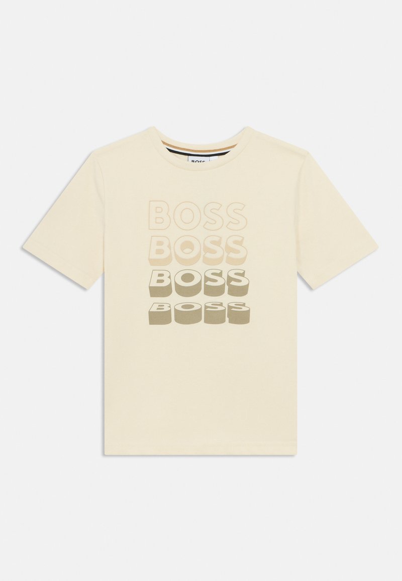 Μπλουζάκι από βαμβάκι σε κρεμ απόχρωση, με τη λέξη «BOSS» τυπωμένη σε διάφορες αποχρώσεις και μεγέθη στο μπροστινό μέρος. Στρογγυλός λαιμός και κοντά μανίκια.
