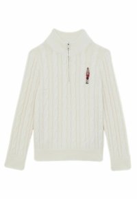 Pull en maille torsadée crème avec col montant, fermeture éclair half-zip, poignets et ourlet côtelés. Présente un petit motif de casse-noisette brodé sur la poitrine.