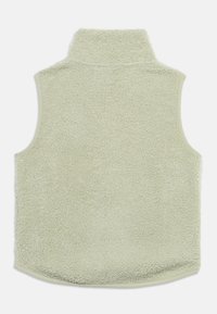 Αμάνικο γιλέκο από φλις σε ανοιχτό πράσινο με ψηλό γιακά, που διαθέτει μαλακή, υφή και χωρίς μανίκια. Το τελείωμα στο κάτω μέρος είναι στρογγυλεμένο.
