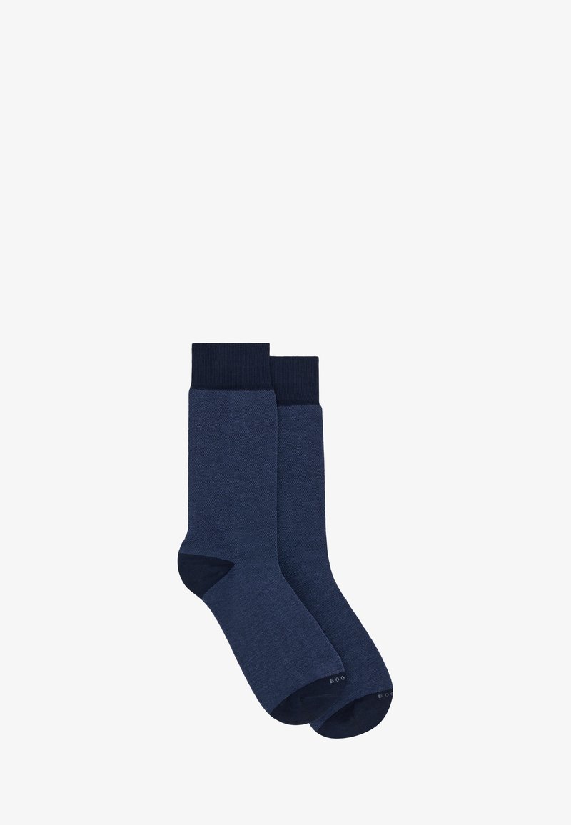 Paire de chaussettes montantes bleu foncé avec des bordures, talons et orteils d'un bleu plus foncé, présentées sur un fond blanc.
