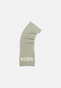 Chaussette de jambe en tricot gris avec une texture côtelée et un design légèrement courbé, arborant le logo "KORS" en crème en bas.